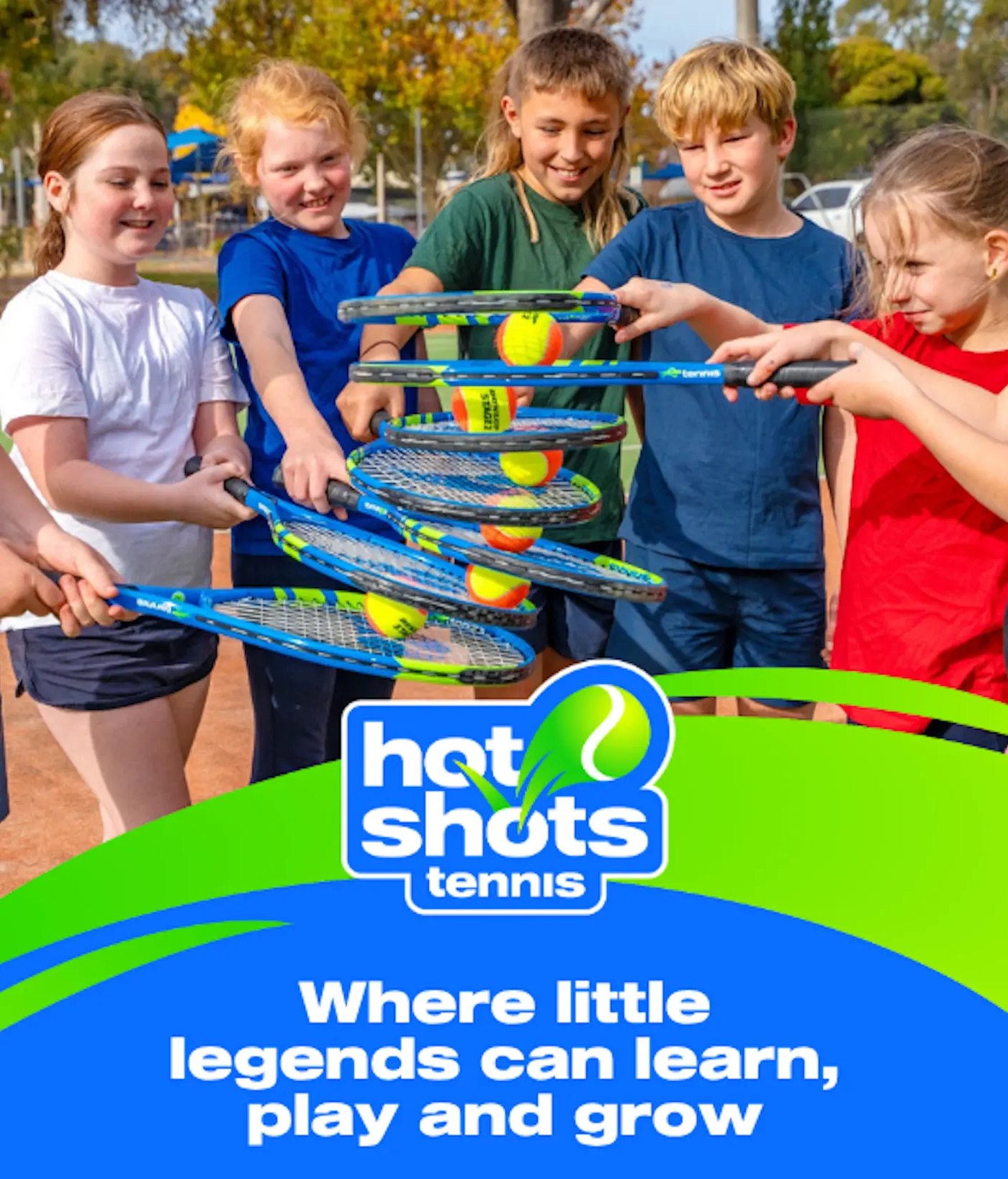 Junior players working together to stack their racquets with tennis balls between them